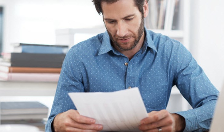 Man looking at the documents