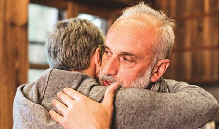Son hugging father