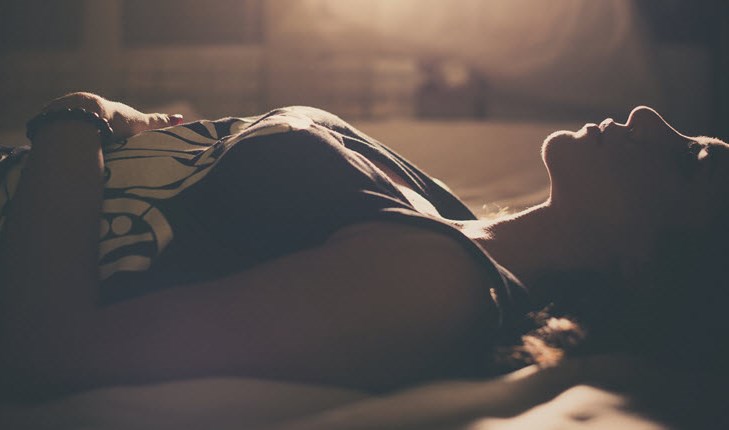 woman lying at the dark