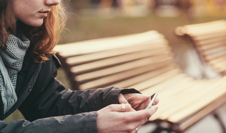 Girl sitting on the bench and waiting
