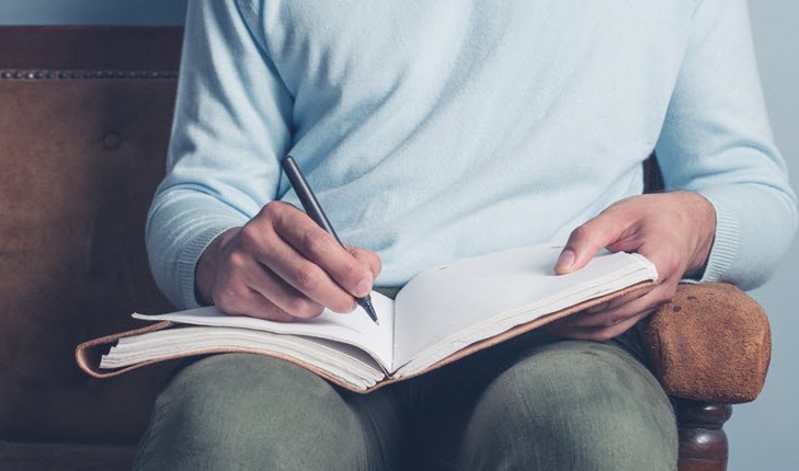 Writing in a notebook