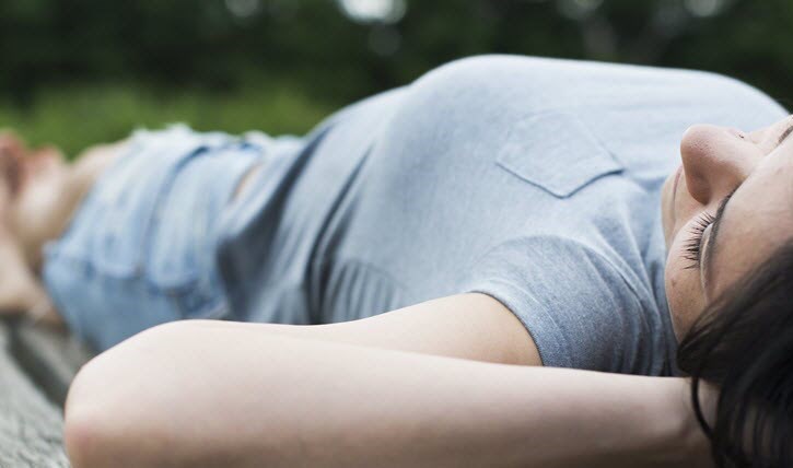 Woman lying and resting on floor