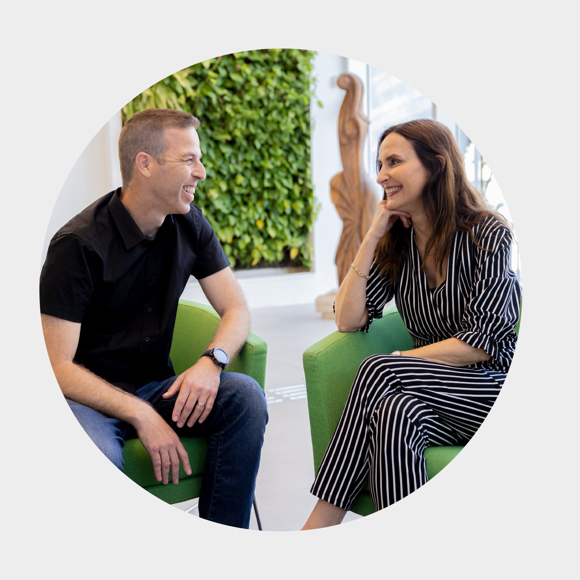 Employees talking in office Israel